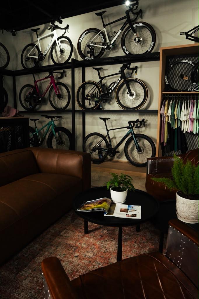 Trek, Giant and gravel bikes on the wall above the lounge